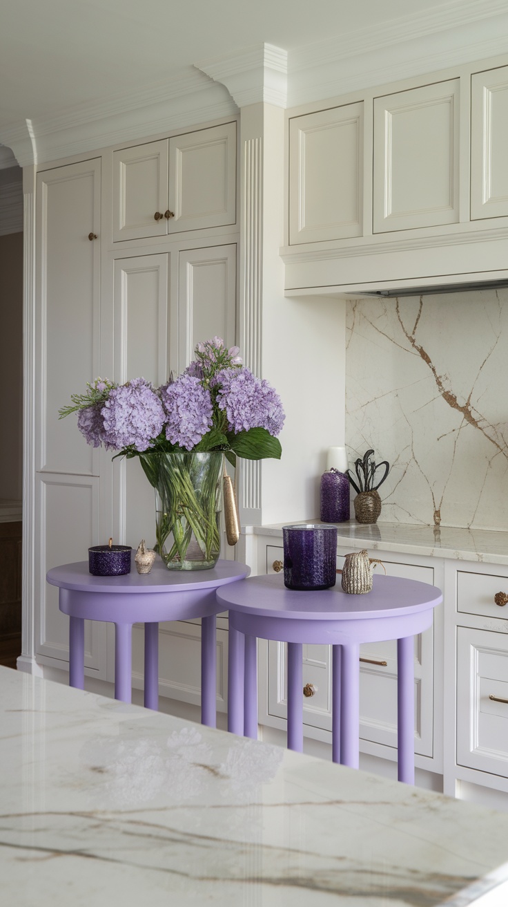 Purple accent tables in a kitchen setting with light cabinetry and marble countertop, featuring floral arrangements and decorative items.